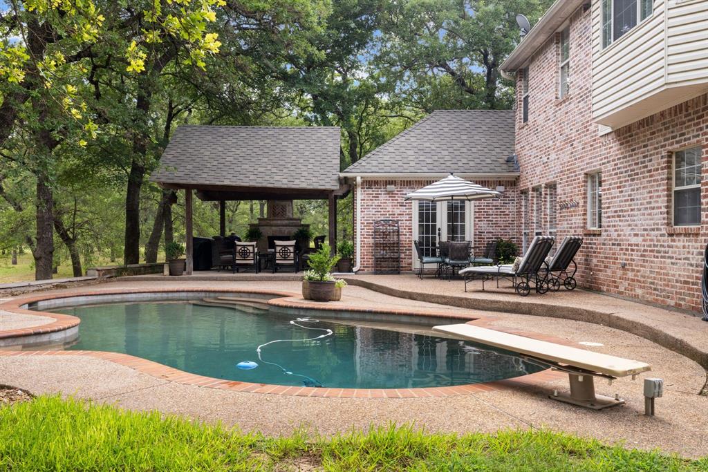 281 County Road 3133 Decatur, TX 76234 - Photo 1 of 1 View of swimming pool featuring a diving board