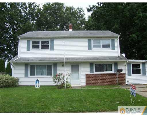 18 Weldon Road Edison, NJ 08817 - Photo 1 of 18 a front view of a house with a yard