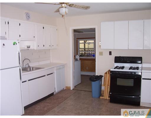 18 Weldon Road Edison, NJ 08817 - Photo 2 of 18 a kitchen with stainless steel appliances granite countertop a stove a sink and a refrigerator