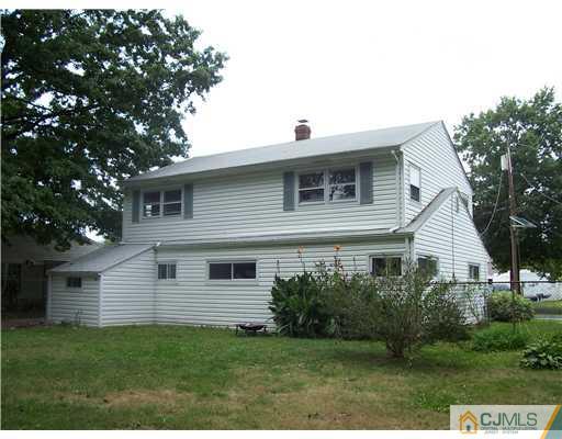 18 Weldon Road Edison, NJ 08817 - Photo 16 of 18 a front view of a house with a yard
