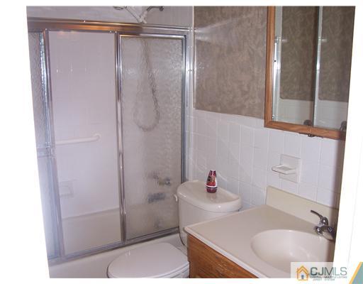 18 Weldon Road Edison, NJ 08817 - Photo 3 of 18 a bathroom with a sink and a shower