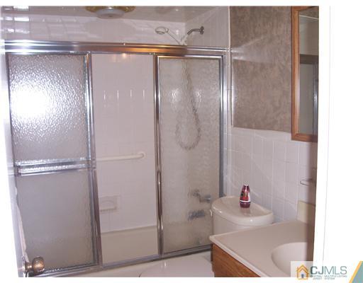 18 Weldon Road Edison, NJ 08817 - Photo 4 of 18 a bathroom with a shower and a sink