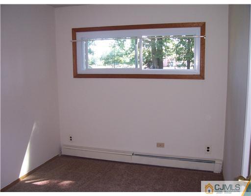 18 Weldon Road Edison, NJ 08817 - Photo 6 of 18 an empty room with a window