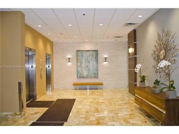a bathroom with a glass door shower