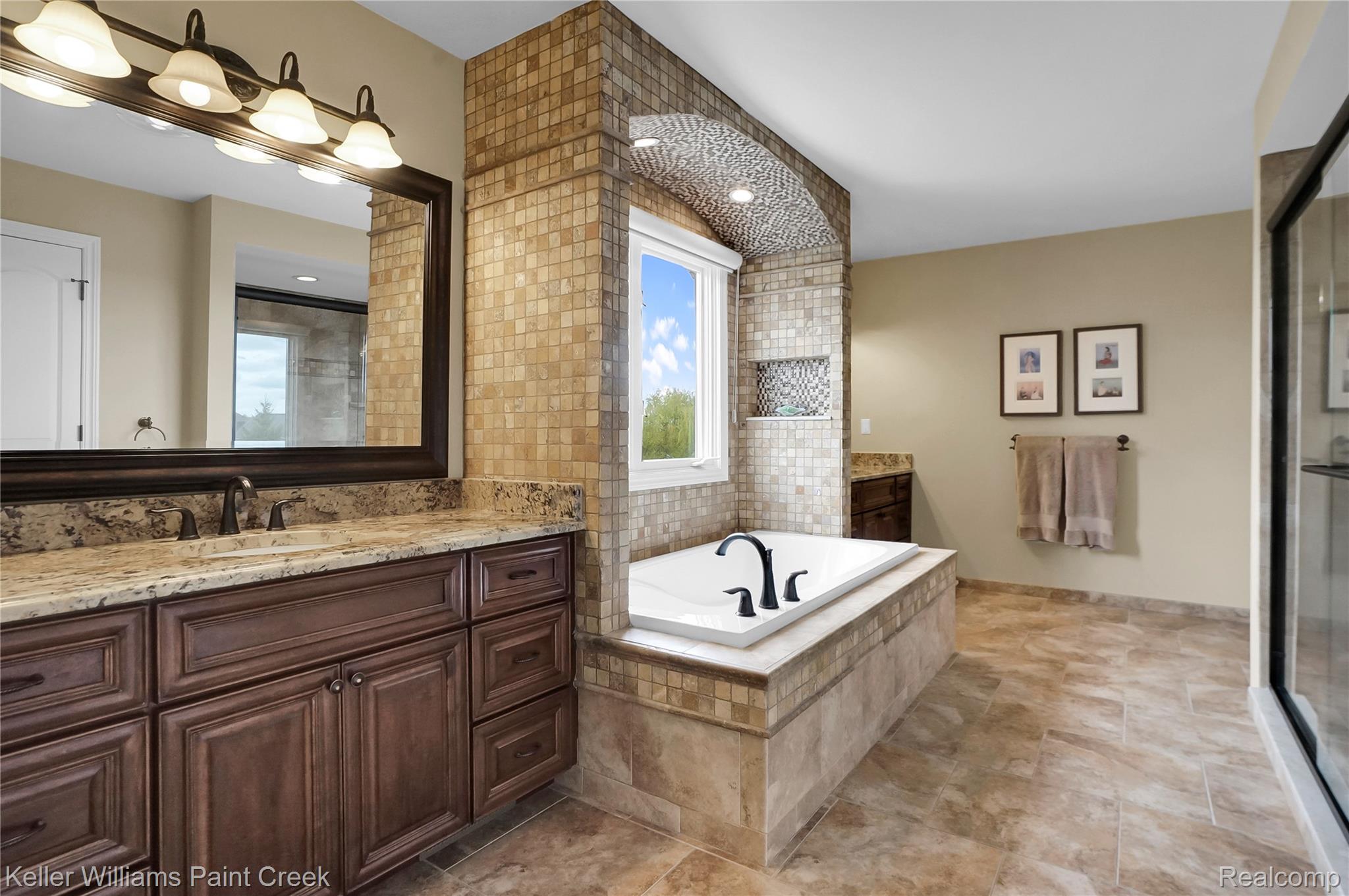 2757 North Addison Circle Rochester, MI 48306 - Photo 42 of 67 The Primary En Suite has separate vanities, a soaking tub, oversized shower and private water closet
