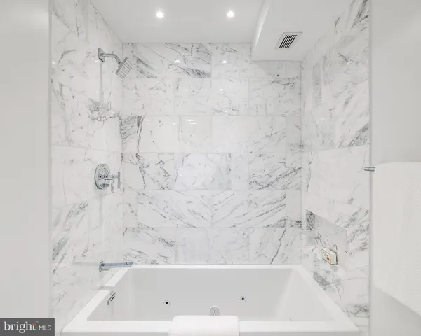 a picture of table and chairs with potted plants