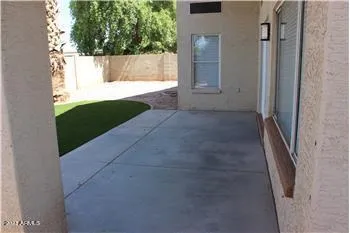 a view of a back yard of the house