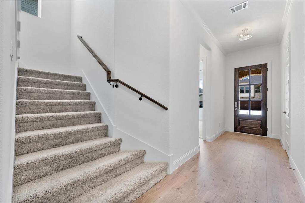 9337 Loggerhead Way Fort Worth, TX 76118 - Photo 29 of 40 a view of entryway and hall with wooden floor