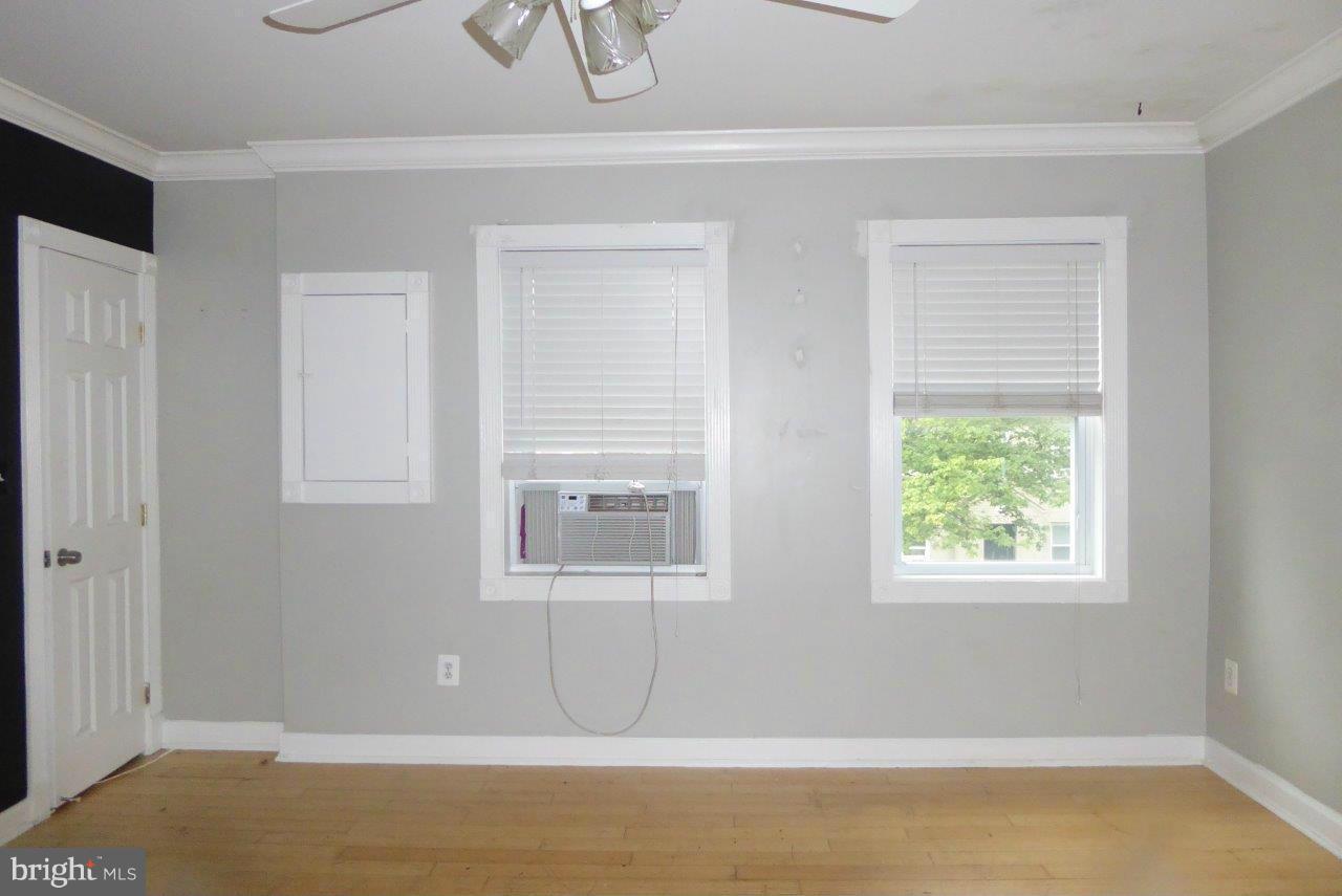 1246 Queen Street Northeast, Unit 3 Washington, DC 20002 - Photo 4 of 14 a view of a room with wooden floor and a window