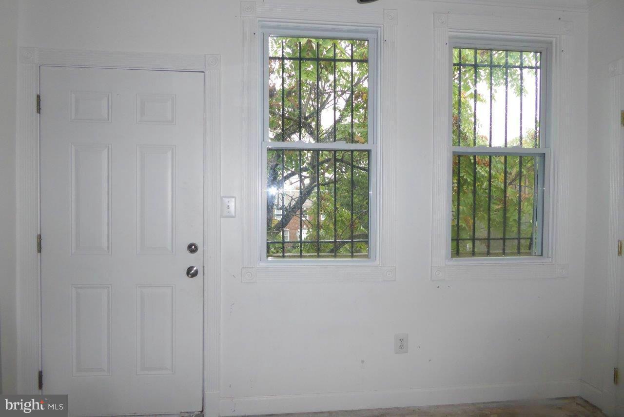 1246 Queen Street Northeast, Unit 3 Washington, DC 20002 - Photo 9 of 14 an empty room with windows