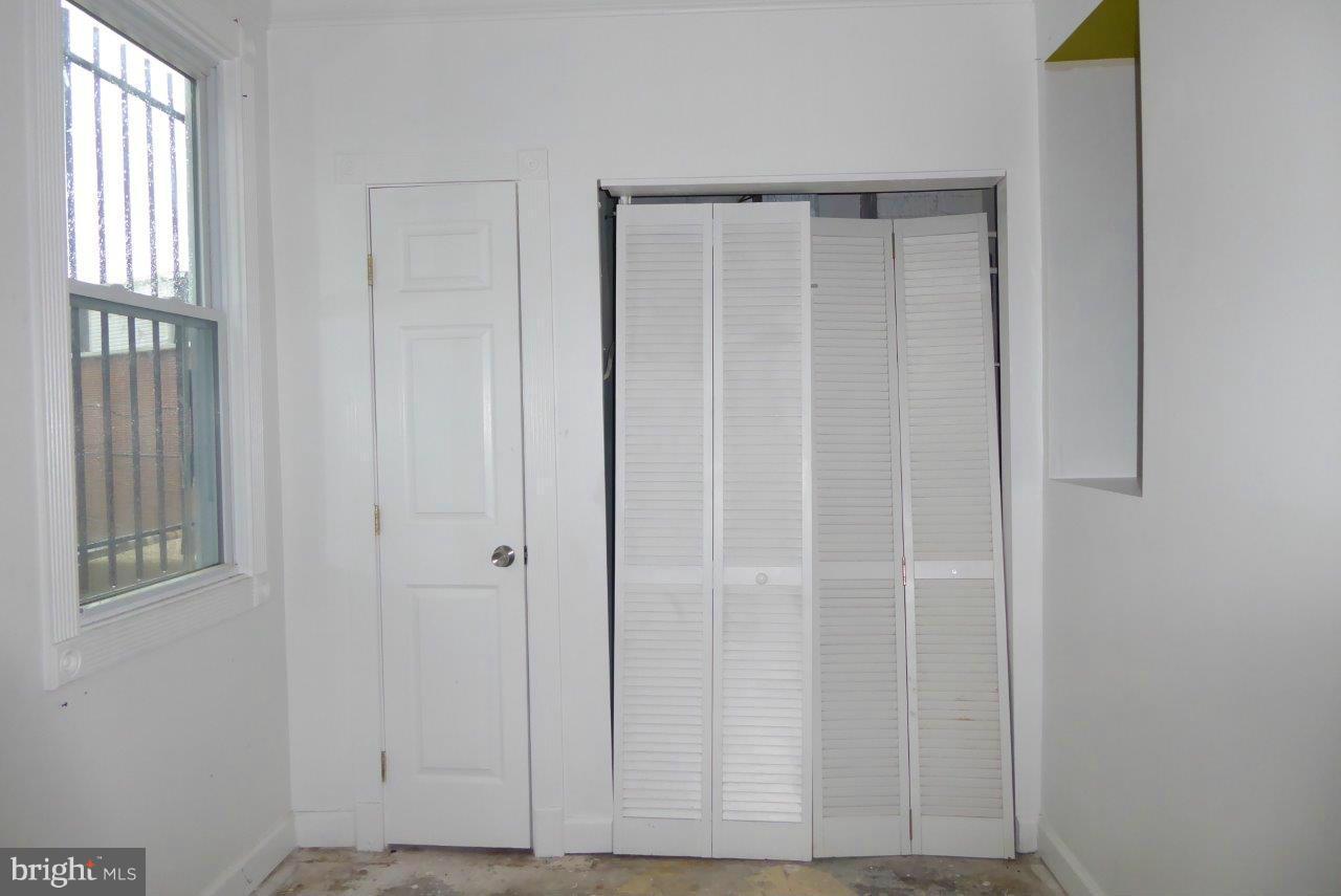 1246 Queen Street Northeast, Unit 3 Washington, DC 20002 - Photo 10 of 14 a view of an entryway with wooden floor