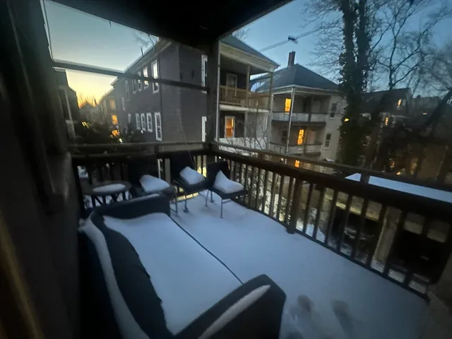 a view of a balcony with chairs