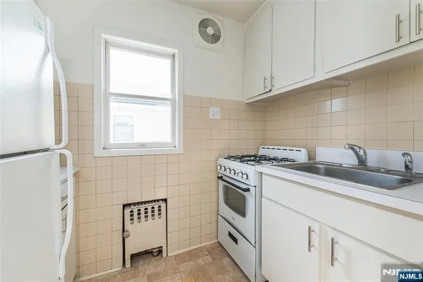 a bathroom with a sink toilet and vanity