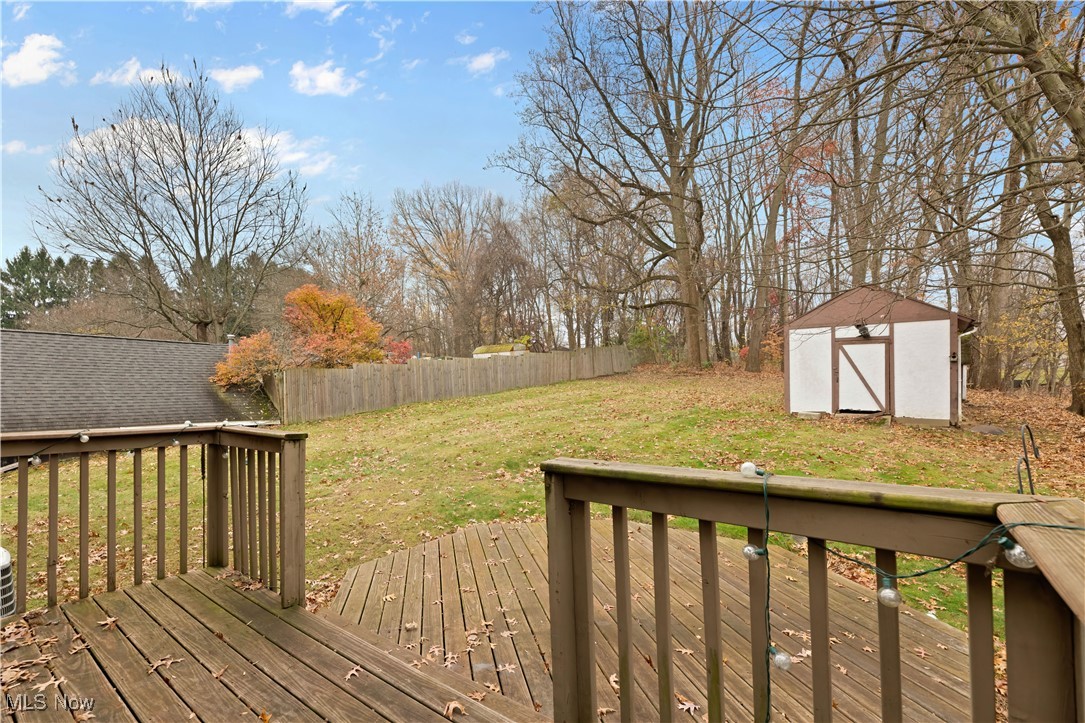 1574 Faye Road Akron, OH 44306 - Photo 37 of 45 Wooden deck featuring a lawn and a storage unit