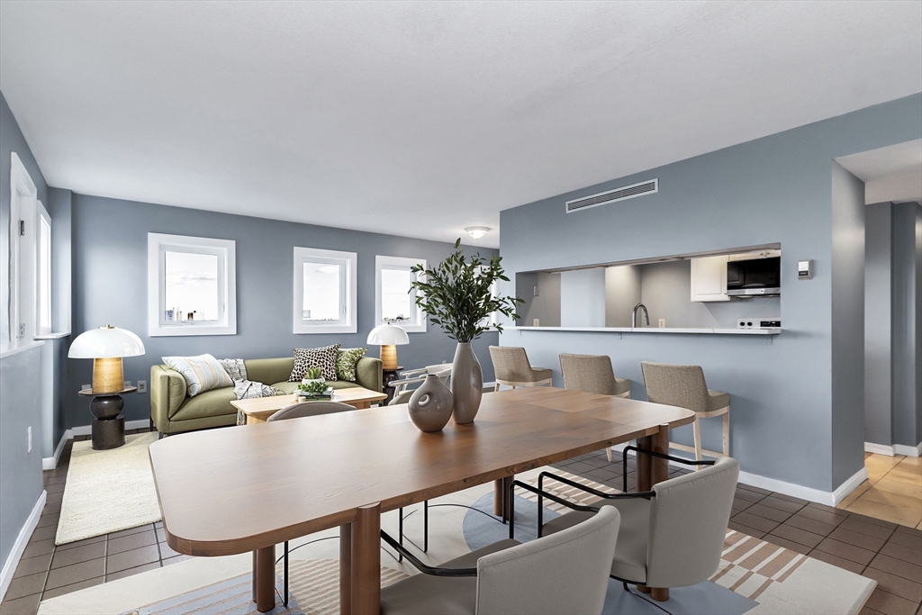 165 Cottage Street, Unit 711 Chelsea, MA 02150 - Photo 12 of 39 a view of a dining room with furniture