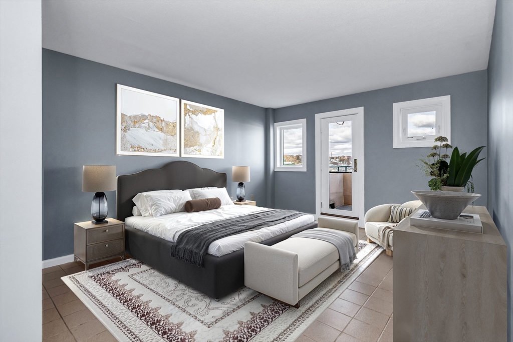 165 Cottage Street, Unit 711 Chelsea, MA 02150 - Photo 23 of 39 a bedroom with a large bed and a window