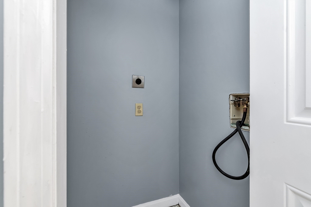 165 Cottage Street, Unit 711 Chelsea, MA 02150 - Photo 30 of 39 a bathroom with a granite countertop vanity and a shower