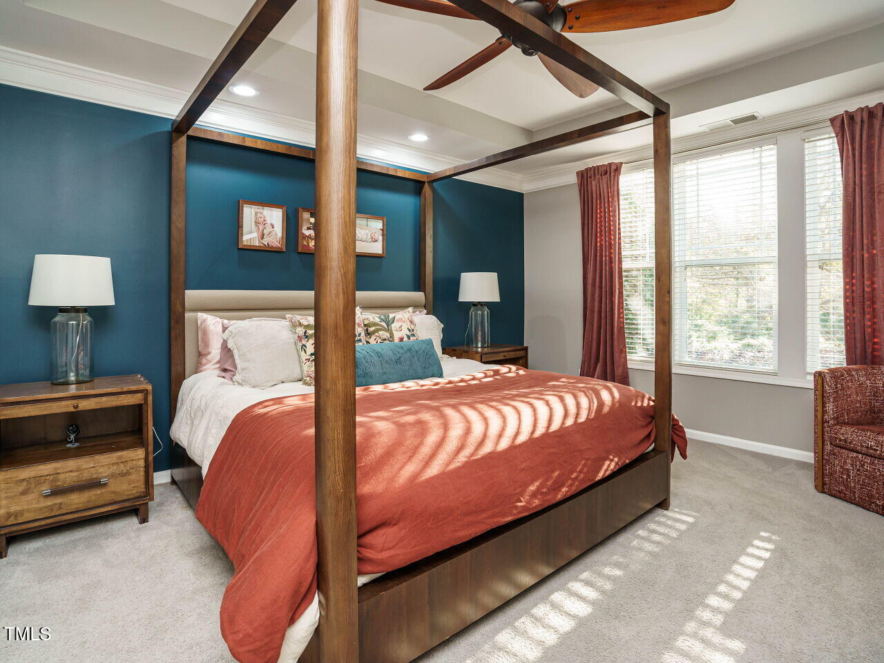 5542 Wade Park Boulevard Raleigh, NC 27607 - Photo 16 of 32 a bed sitting in a bedroom next to a window