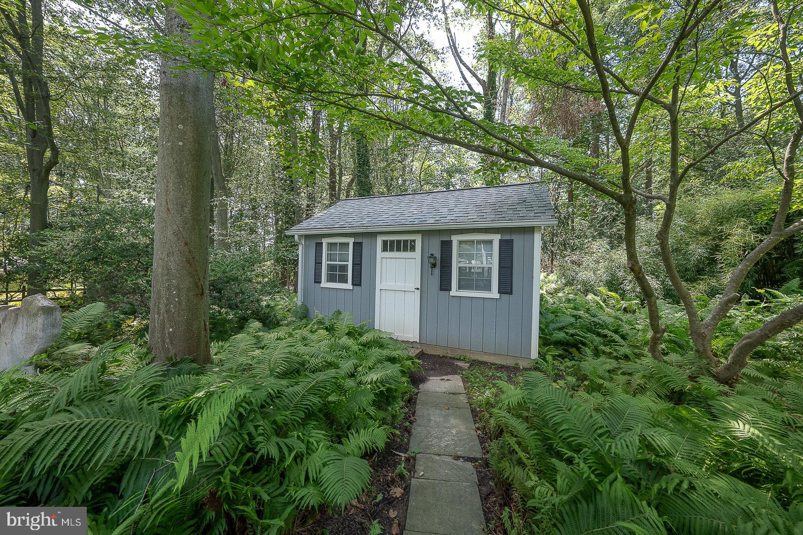 738 Woodcrest Road Wayne, PA 19087 - Photo 21 of 28 Shed surround by lush greens