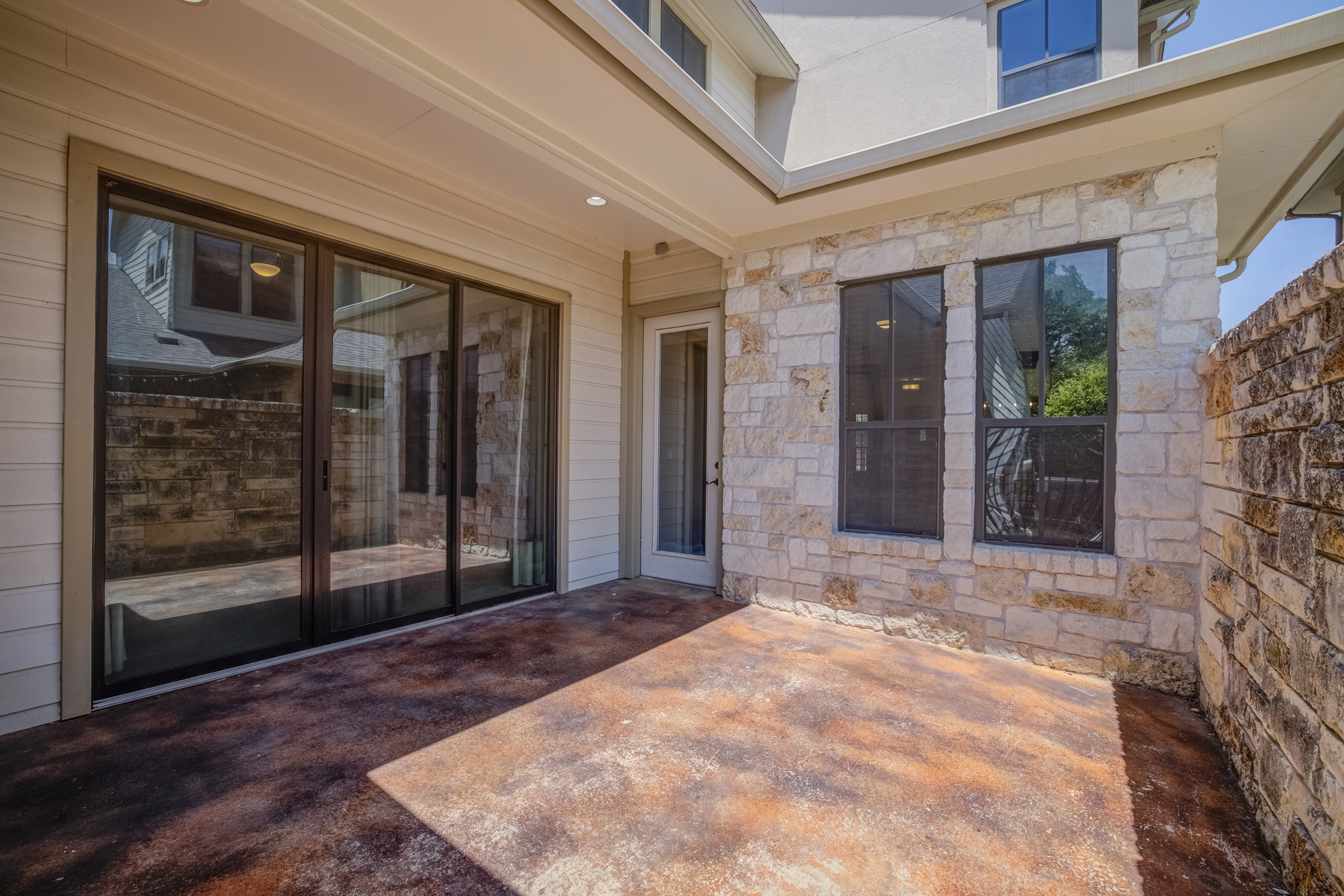 4524 Berkman Drive Austin, TX 78723 - Photo 36 of 38 Covered patio featuring an exposed aggregate concrete surface