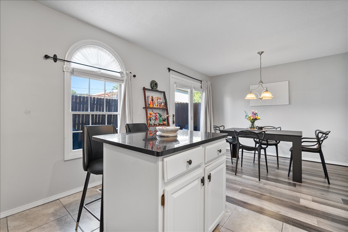 903 North Linden Street, Unit 232 Normal, IL 61761 - Photo 12 of 25 a dining hall with stainless steel appliances granite countertop furniture a fireplace and a chandelier