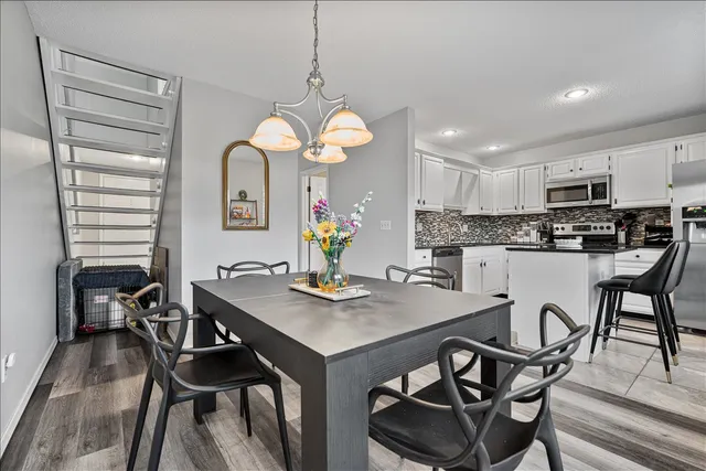 a view of a dining room kitchen furniture and a chandelier