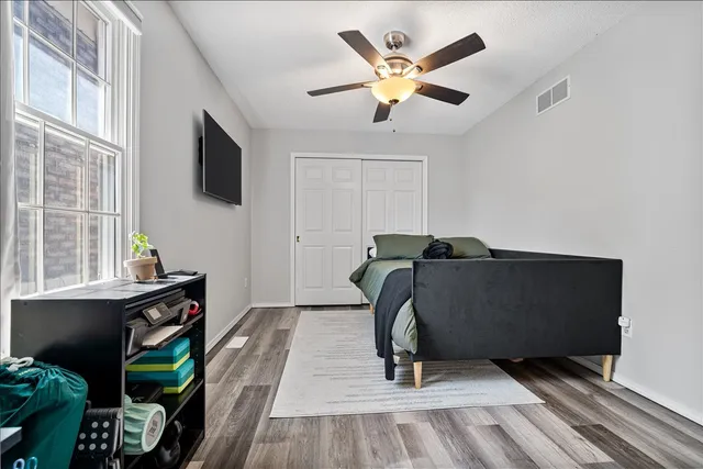 a view of a livingroom with furniture and a flat screen tv