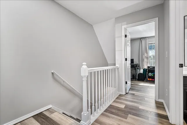 a view of a hallway view with staircase