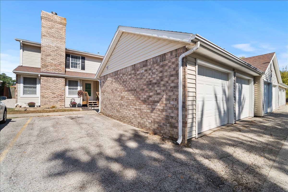 903 North Linden Street, Unit 232 Normal, IL 61761 - Photo 24 of 25 a view of a house with a wooden fence