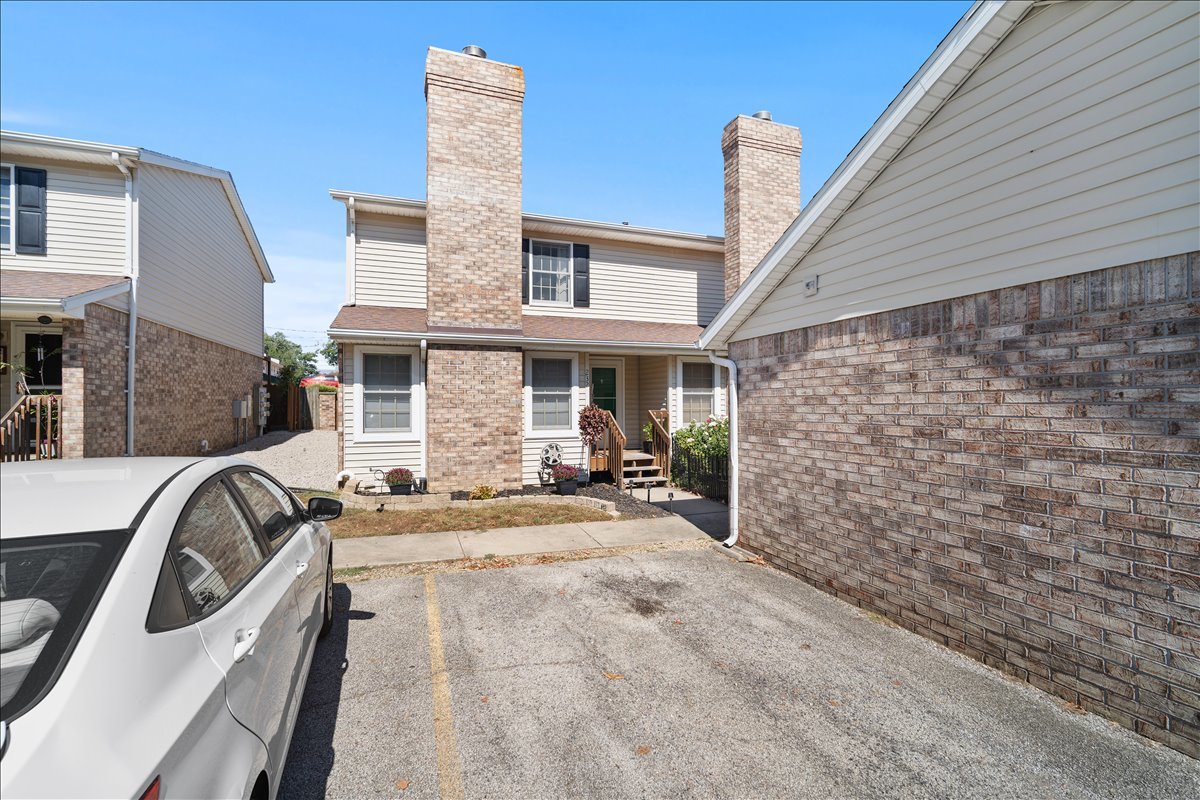 903 North Linden Street, Unit 232 Normal, IL 61761 - Photo 25 of 25 a view of a patio with chairs and barbeque