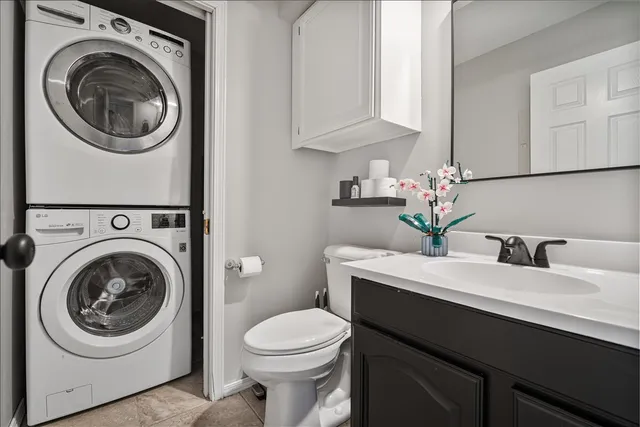a bathroom with a sink a toilet and mirror