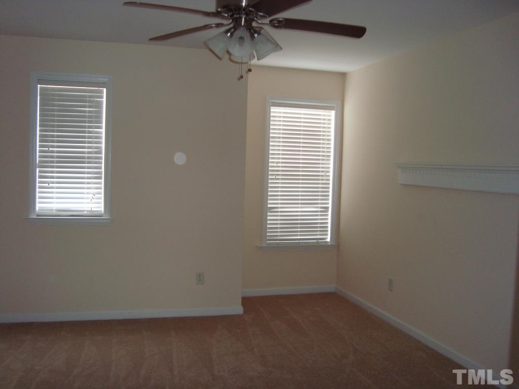 11035 Louson Place Raleigh, NC 27614 - Photo 18 of 24 One of the secondary bedrooms upstairs with 2 windows, built in display shelf and new carpet!