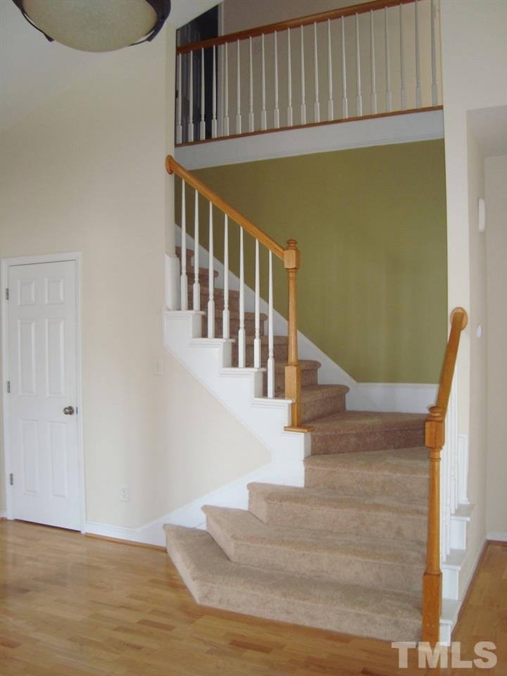 11035 Louson Place Raleigh, NC 27614 - Photo 21 of 24 Wide, angled staircase with new carpet!