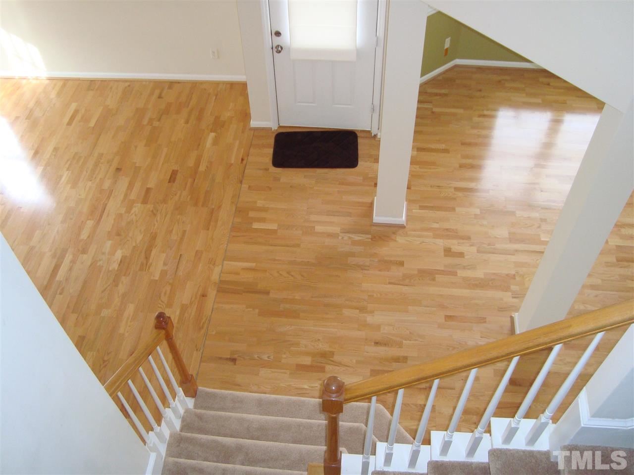 11035 Louson Place Raleigh, NC 27614 - Photo 24 of 24 The view from upstairs in this open floor plan shows the beautiful wood floors!