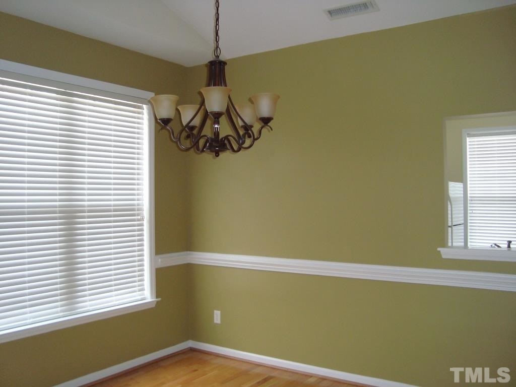 11035 Louson Place Raleigh, NC 27614 - Photo 10 of 24 Wood flooring and newer light fixture!