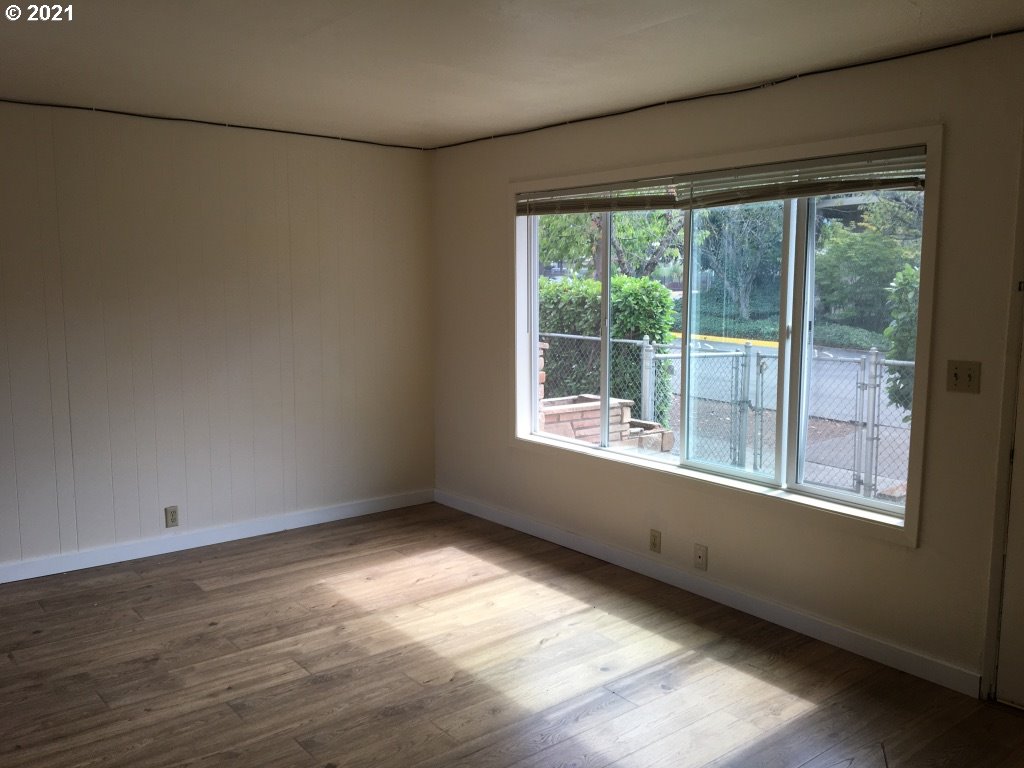 310 Mill Street Springfield, OR 97477 - Photo 6 of 9 a view of an empty room with a window