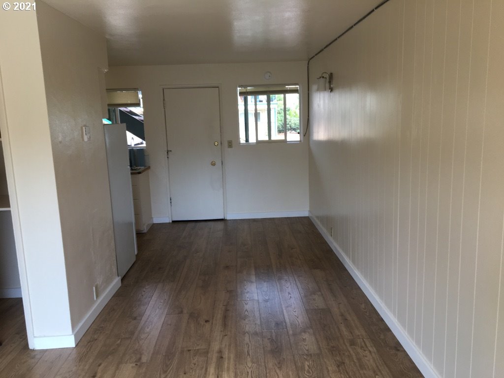 310 Mill Street Springfield, OR 97477 - Photo 9 of 9 wooden floor in an empty room with wooden floor