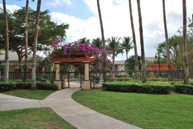 a view of a house with a swimming pool and a porch