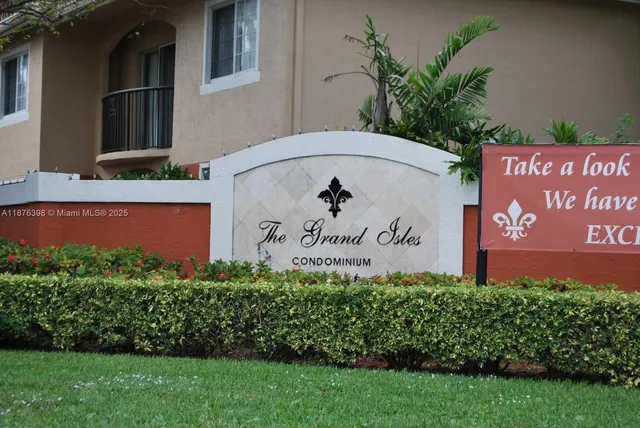 a couple of cars parked in front of a building