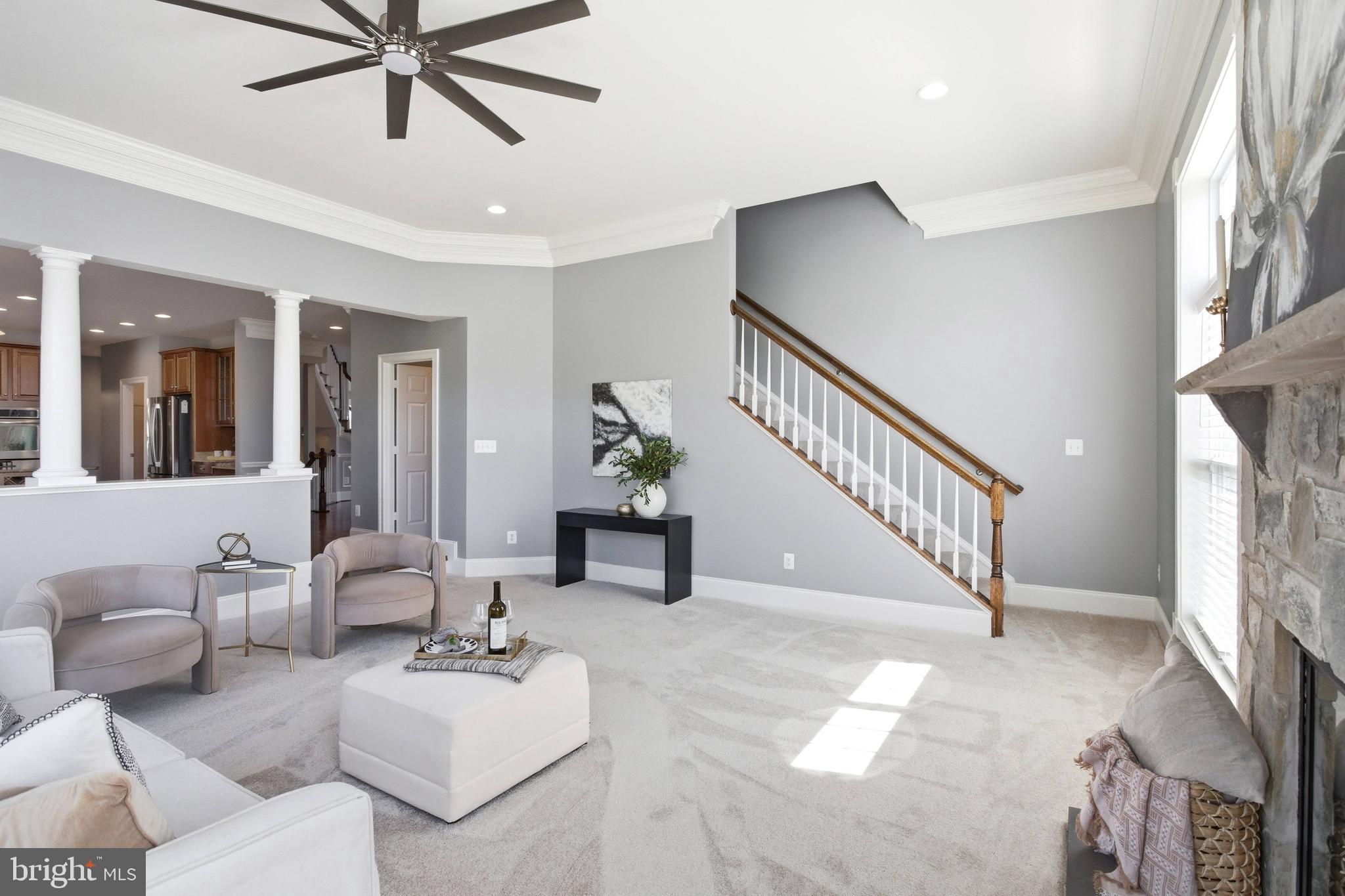 18475 Kerill Road Triangle, VA 22172 - Photo 45 of 99 a living room with furniture and a chandelier