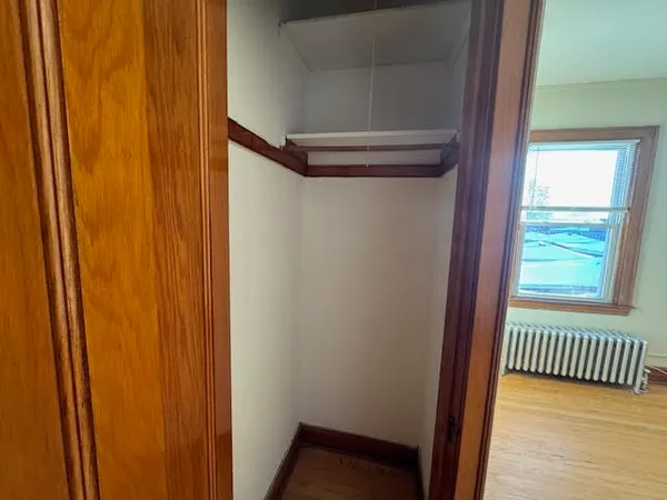 a view of a hallway with a window