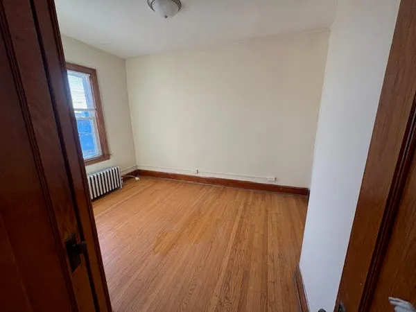 a view of a room with wooden floor and stairs