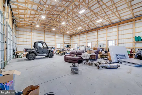 an aerial view of a house with a lake view