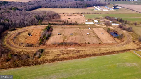 a kitchen with stainless steel appliances granite countertop a refrigerator a stove and a sink