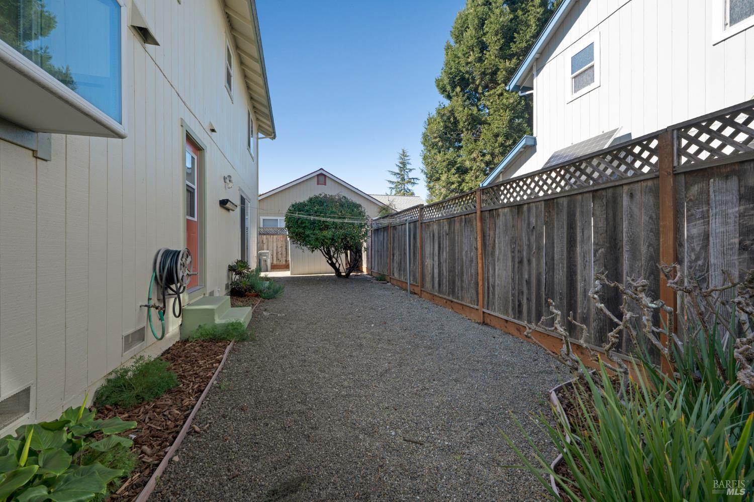 1905 Belair Way Santa Rosa, CA 95403 - Photo 22 of 27 a view of backyard with potted plants and wooden fence