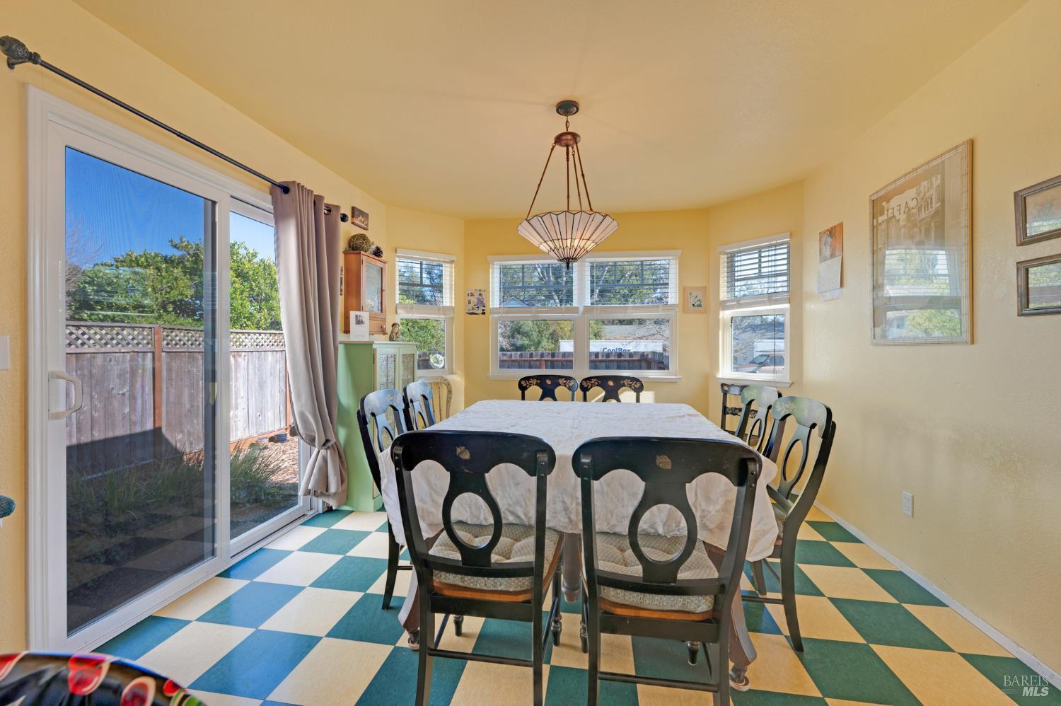 1905 Belair Way Santa Rosa, CA 95403 - Photo 8 of 27 a dining room with furniture wooden floor and a rug