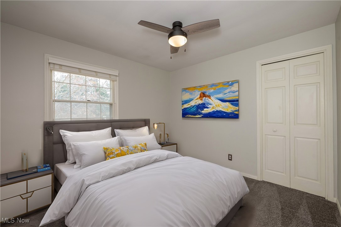 3721 20th Street Northwest Canton, OH 44708 - Photo 11 of 47 Virtually Staged. Bedroom with ceiling fan, dark carpet, and a closet