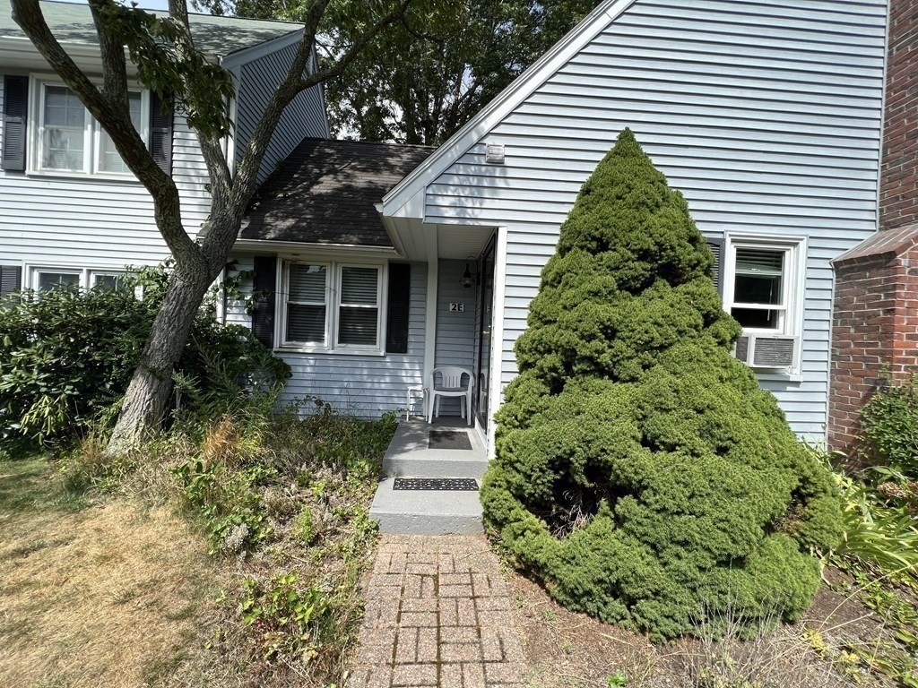 12 State Road, Unit 2E Plymouth, MA 02360 - Photo 23 of 28 a front view of a house with a yard
