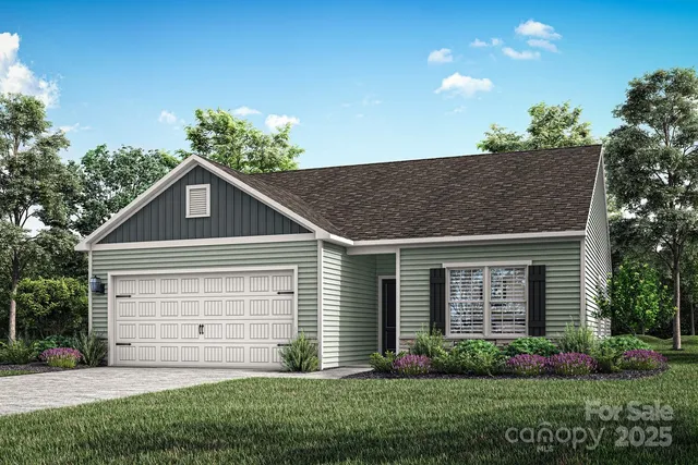 a house that is sitting in front of a big yard with potted plants