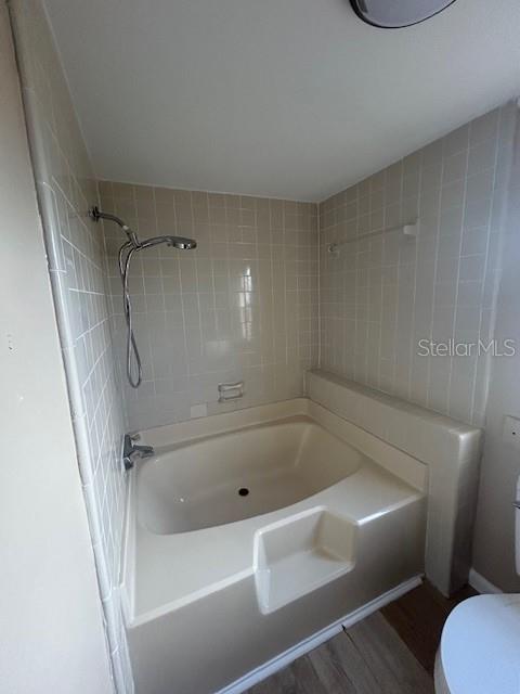 2095 Haas Road Apopka, FL 32712 - Photo 12 of 17 a bathroom with a tub and a shower